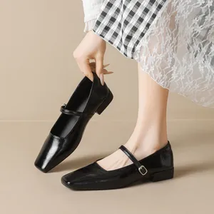 Classic black square-toe Mary Jane flats with slim strap and subtle leather luster