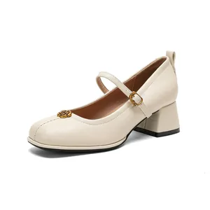 Elegant off-white Mary Jane pumps with block heels and golden camellia flower metal trim