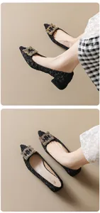 Close-up of black pointed-toe chunky heels featuring a luxury crystal square buckle