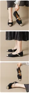 Detail of elegant two-tone Mary Jane flats featuring black satin and gold pointed toe cap