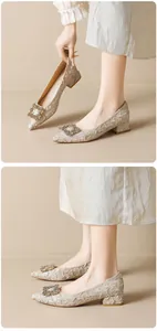 Detail of champagne pointed toe pumps featuring pleated fabric and crystal buckle