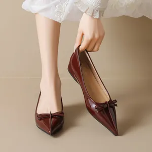Elegant wine red patent leather pointed flats with bow detail and wedge heel