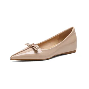 Elegant pointed toe nude patent leather ballet flats with decorative bow detail