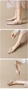 Close-up of elegant nude pointed-toe slingback flats with glossy patent leather toe