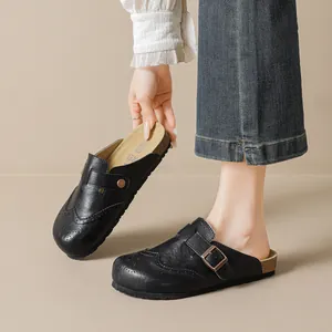 Retro black leather Birkenstock style clogs with brogue carving and cork sole for women