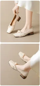 Detail of cream square-toe Mary Jane with pearl rhinestone strap and block heel