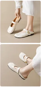 Close-up of ruched beige mule shoes with gold metal buckle and textured leather detail