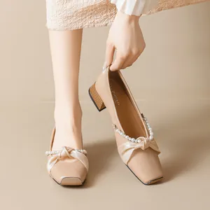 Elegant square toe Mary Jane heels with pearl bow and wood grain block heel in apricot