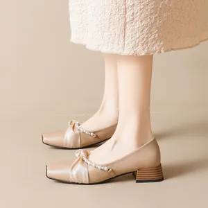 Beige square toe Mary Jane pumps with bow and pearl strap on 3-5cm block heels