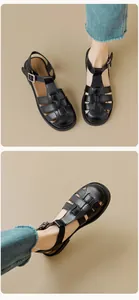 Detail of woven black gladiator sandals with block heels and a vintage closed-toe design