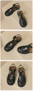 Close-up of black woven leather fisherman sandals featuring adjustable metal buckle