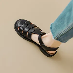 Women's black woven leather fisherman sandals with thick soles and buckled heel straps
