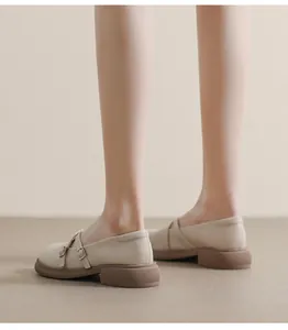 Detail of beige Mary Jane shoe with crossover straps and thick anti-slip sole