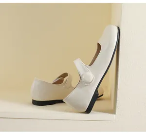 Detail of cream Mary Jane flat with round toe and strap buckle in minimalist niche