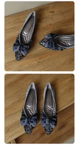 Detail of blue silk bow with dark rhinestones on silver pointed flat shoe for women