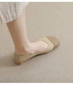 Detail of square toe flat shoes with beige leather texture and contrast perforated toe