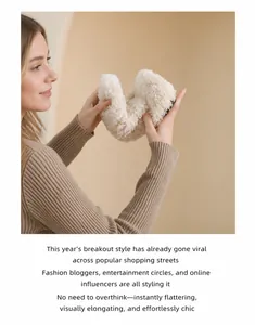 Flexible cream faux fur flat shoe showing the bendable soft sole and plush texture