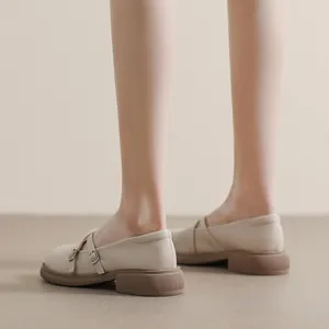 Beige platform Mary Jane loafers with crisscross straps and vintage matte leather finish