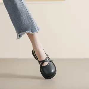 Classic black platform Mary Jane shoes with double criss-cross straps and matte finish