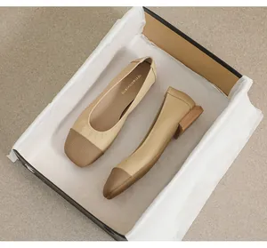 Detail view of square toe flat shoes in apricot leather with quilted contrast toe cap