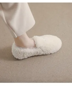 Detail view of plush faux fur round toe slippers with soft warm fleece lining and sole