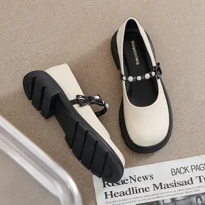 French style cream Mary Jane shoes with thick platform soles and pearl bow details