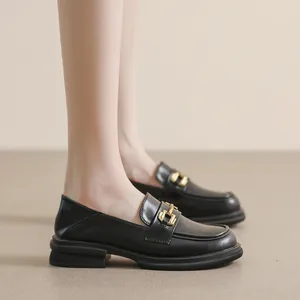 Classic black platform loafers for women with matte leather and gold metal buckle detail