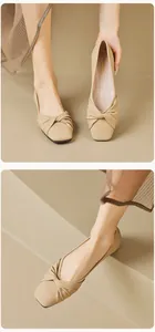 Close-up of beige leather flat shoes featuring an elegant knot detail on the square toe
