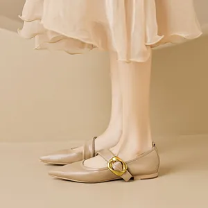 Elegant pointed toe Mary Jane flat shoes in beige leather with a large gold metal buckle