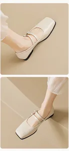 Detail von cremefarbenen Mary Jane Ballerinas mit eckiger Zehenpartie und zwei Riemchen