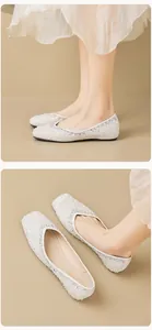 Close-up detail of silver sequin ballet flats with sparkling rhinestones and square toe design