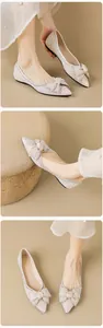 Detailansicht der champagnerfarbenen spitzen Ballerinas mit Strass und Schleife