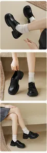 Detail view of black platform lace-up oxfords with textured sole and premium faux leather finish