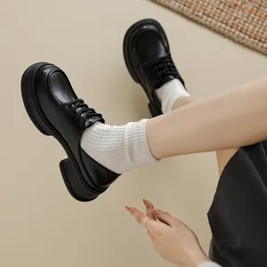 Classic black platform loafers for women with thick soles and lace-up round toe design