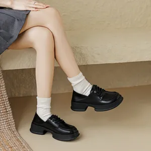 Classic black chunky platform derby shoes with lace-up design in British preppy style