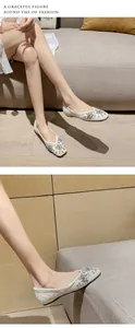 Detailed view of women's flat shoes featuring elegant pearls and rhinestone flower patterns