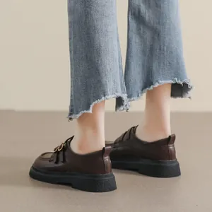 Retro dark brown platform loafers in matte leather with metallic buckle on thick rubber sole