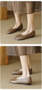 Macro detail of pleated round toe retro brown leather ballet flats on a model