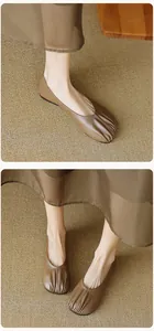 Detail of soft leather flats with pleated round toe design and retro french style