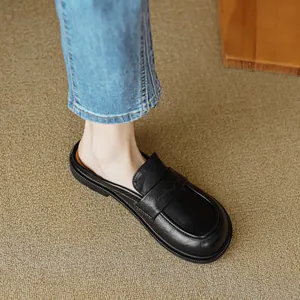 Classic black leather mules with loafers buckle detail and flat sole for women style