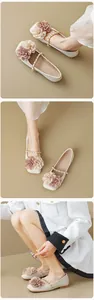 Detailed view of cream square toe flats with 3D floral accents and gold chain strap