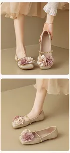 Detail of square toe flat shoe with silk velvet fabric and elegant 3D floral accents