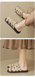 Detail of French vintage woven beige sandals featuring a buckled strap and non-slip sole