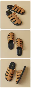 Close-up of brown woven leather sandals featuring bronze metal buckles and a thick black sole