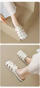 Detailed view of beige woven leather flat mules with elegant square toe design