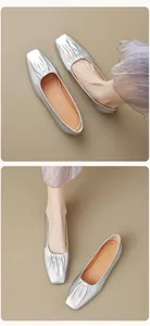 Detailed view of silver square toe ballet flats with metallic pleated finish and soft sole