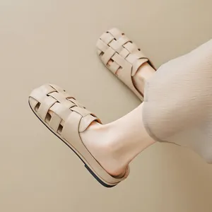 French style woven closed-toe mules for women in beige with a soft flat sole