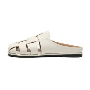 French style woven pointed toe mule flats in cream beige leather with a soft rubber sole