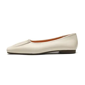 Elegant beige square toe ballet flats with ruched detailing on a minimal soft sole