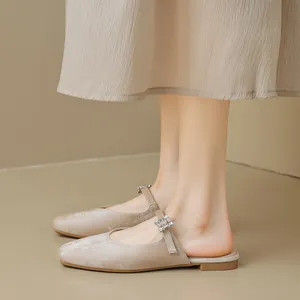 Elegant champagne gold pointed toe flat mule shoes with rhinestone buckle and soft suede